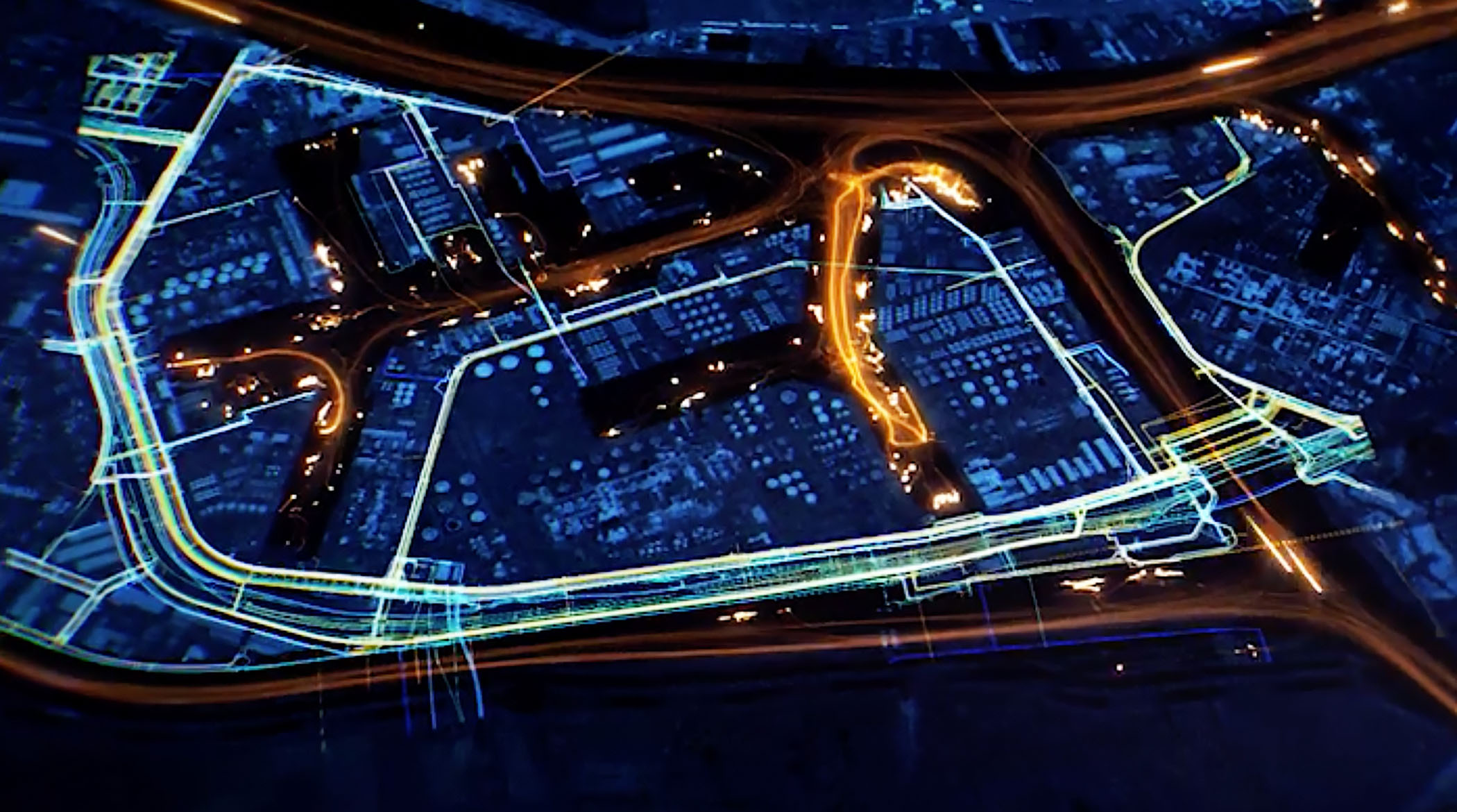 A stylized digital map of a city in dark colors with various routes and infrastructure glowing