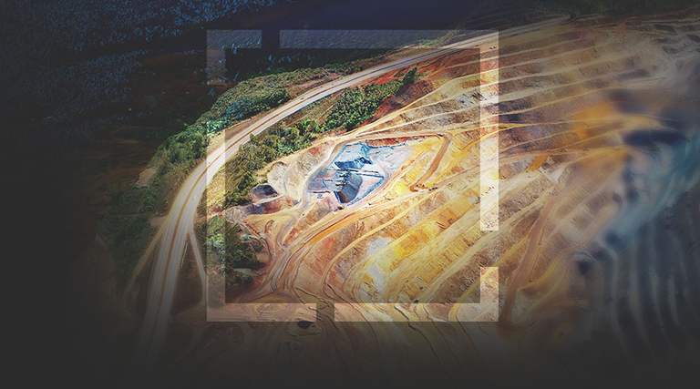 A high quality, very realistic drone image of a large open-pit mine